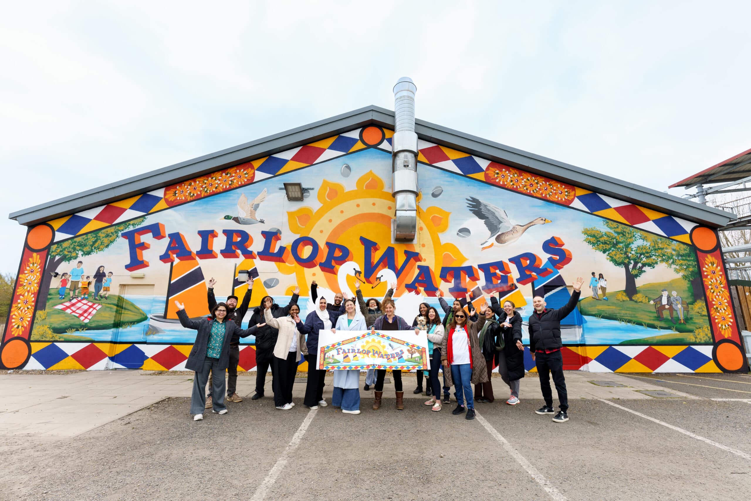 Group of community members in front of new Fairlop Waters mural