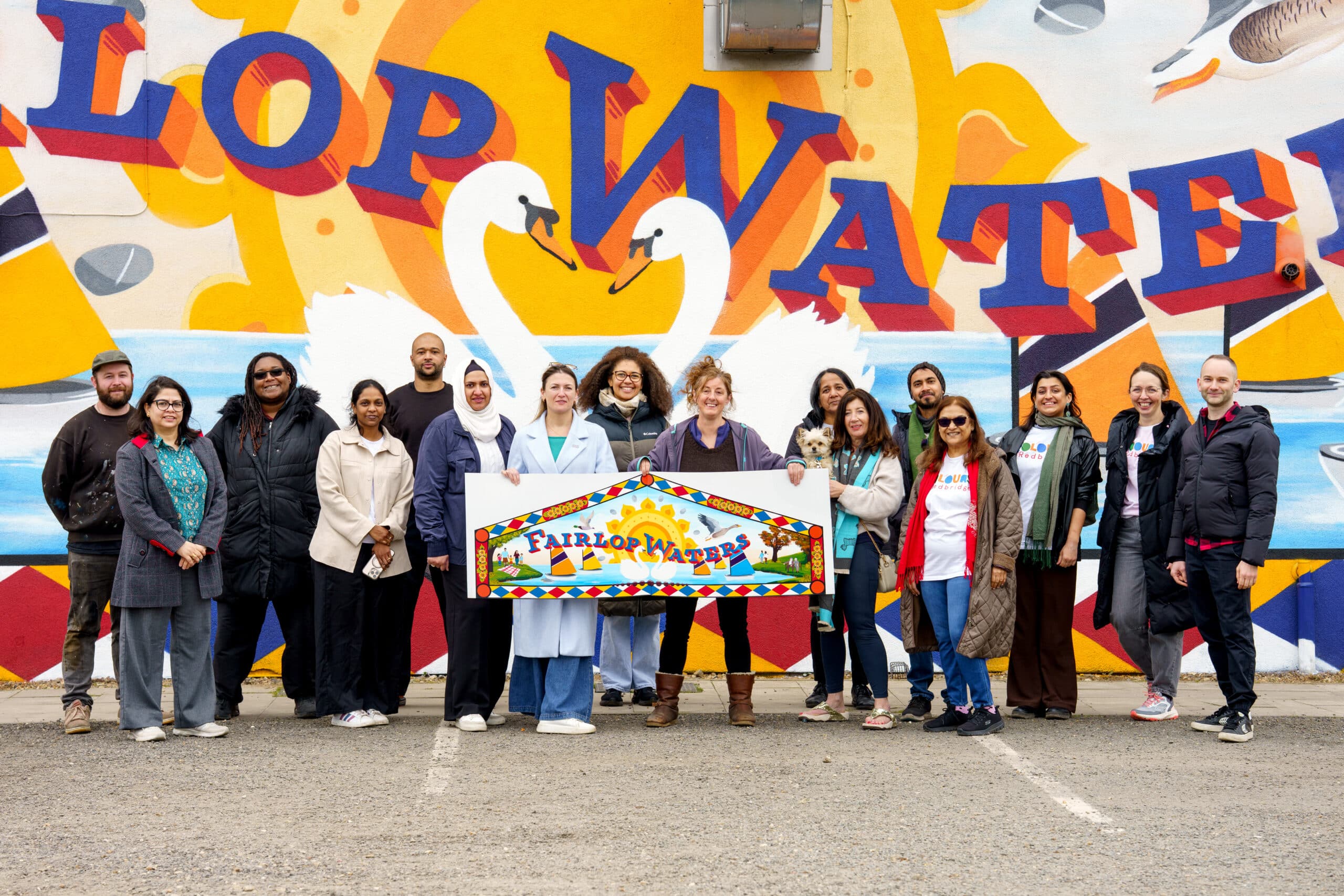 Group of community members in front of new Fairlop Waters mural