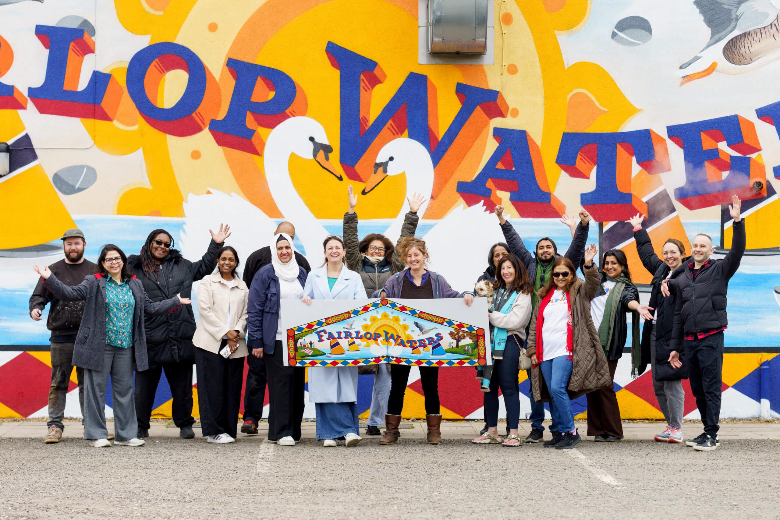 Group of community members in front of new Fairlop Waters mural