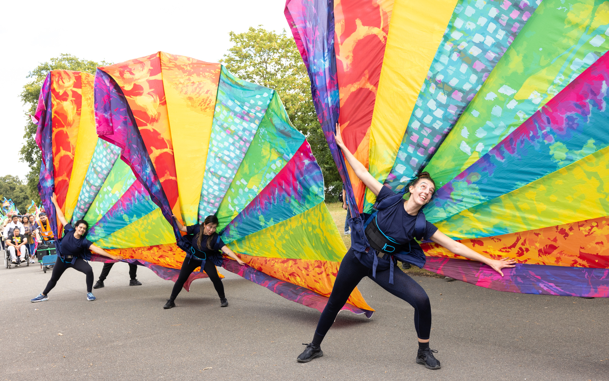 Giant colourful fan performers at Colours of Redbridge Street Parade