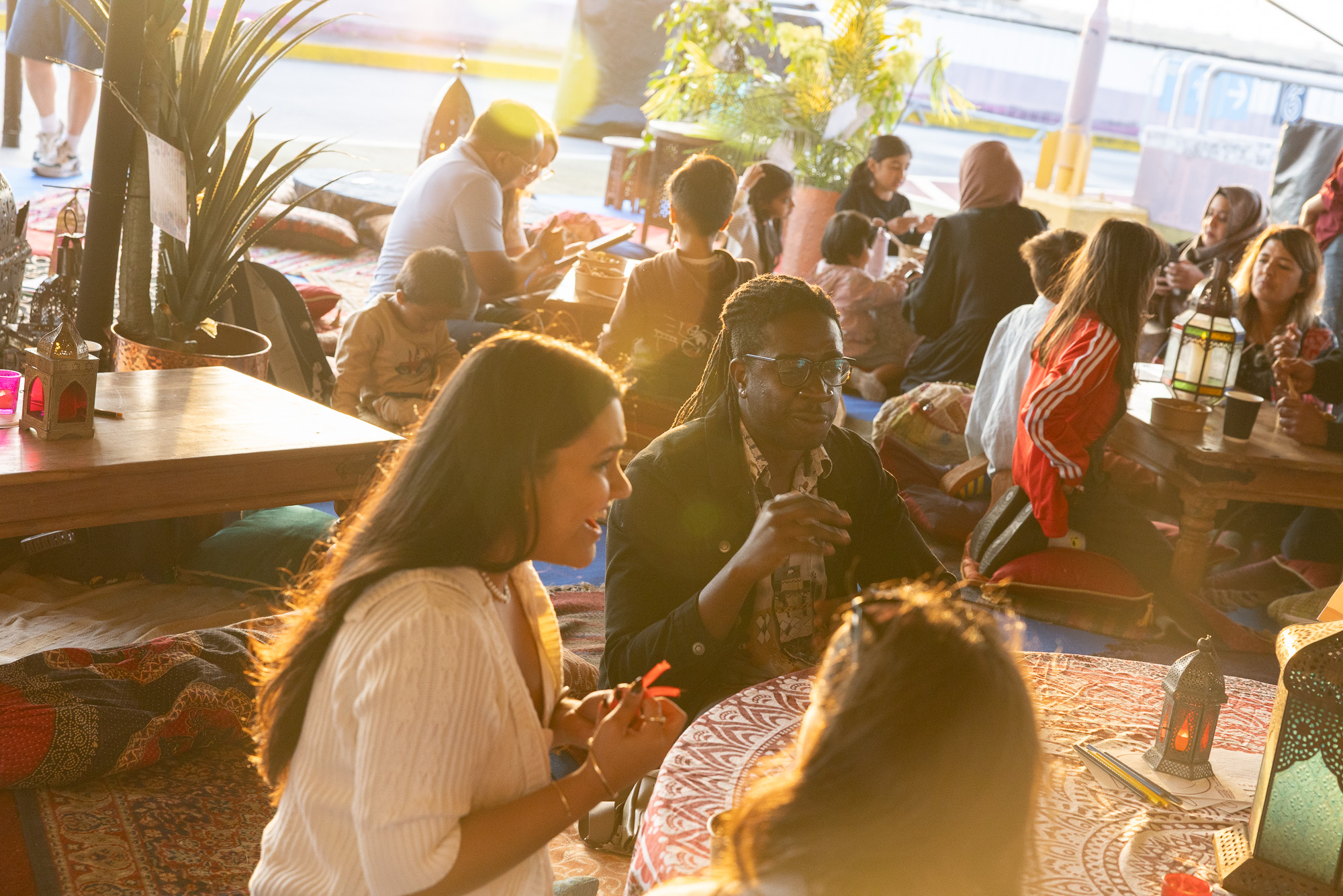 Golden hour - people eating at a table during a sunset