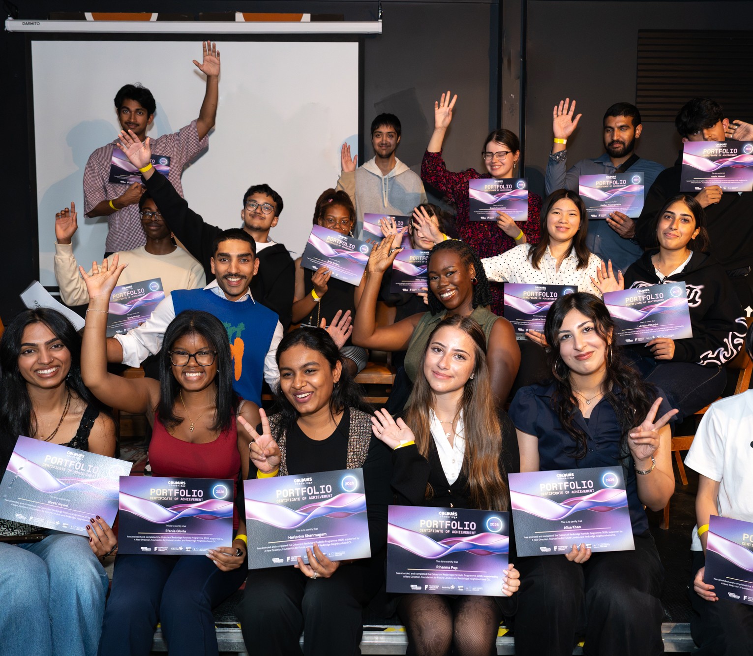 Group of young people holding certificates