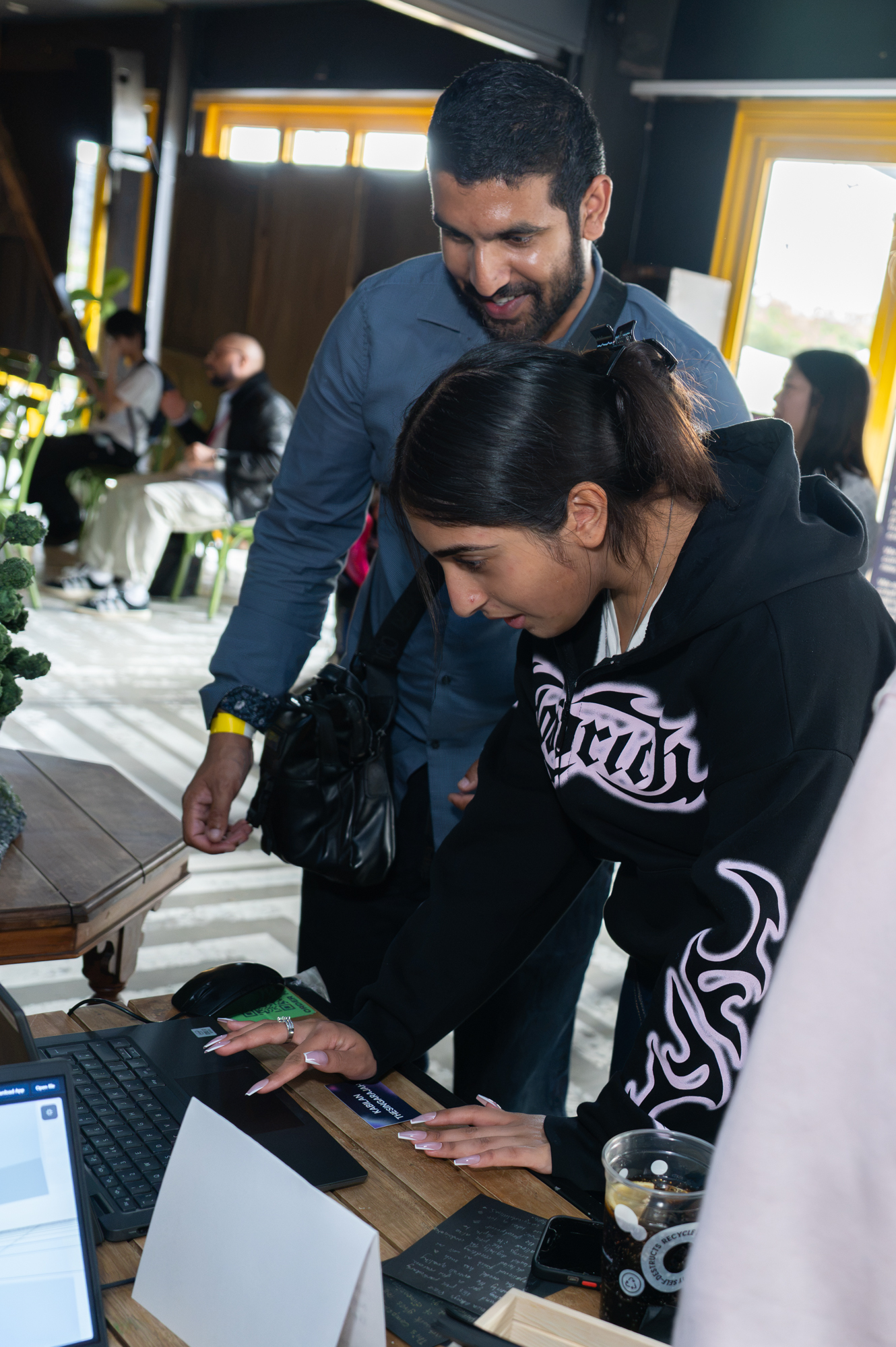 People looking at a laptop